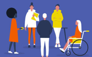 Eine Gruppe von Personen, eine davon stitz im Rollstuhl.